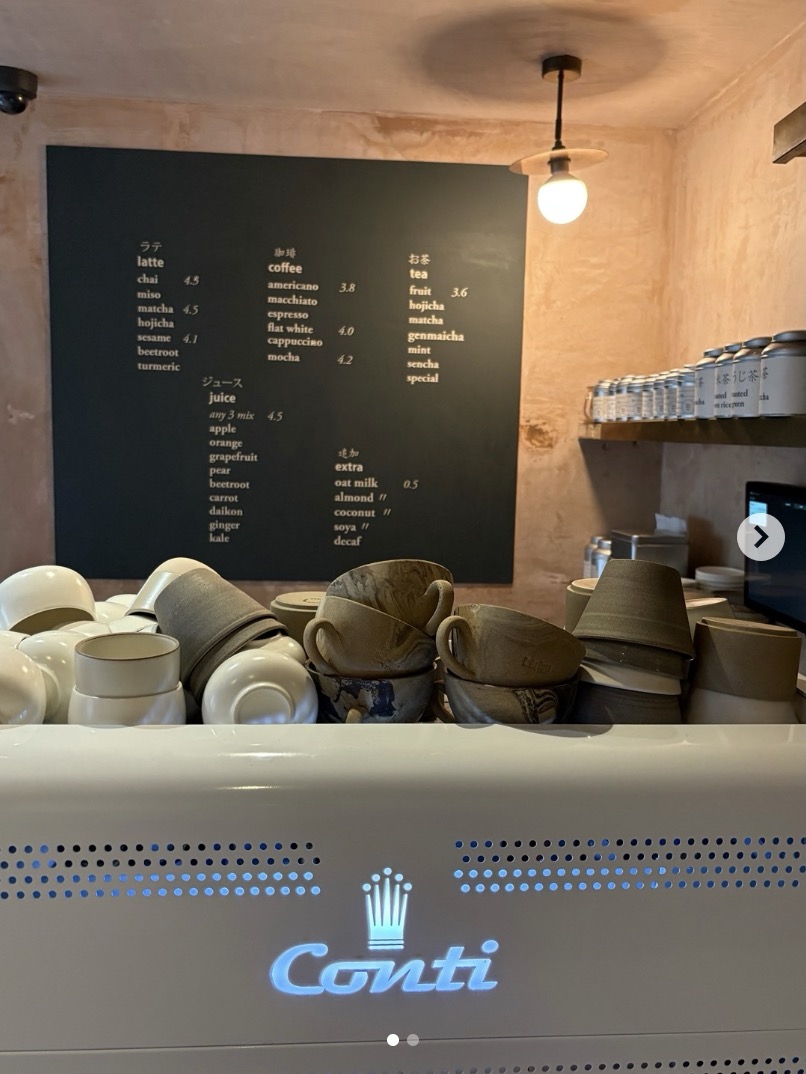 Uchi Bake's drinks menu and espresso counter at the original Clapton shop — matcha, hojicha and sesame lattes alongside coffee